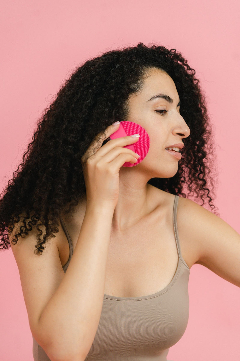 PrimeLux Silicone Cleansing Brush – Woman using a silicone facial cleansing brush